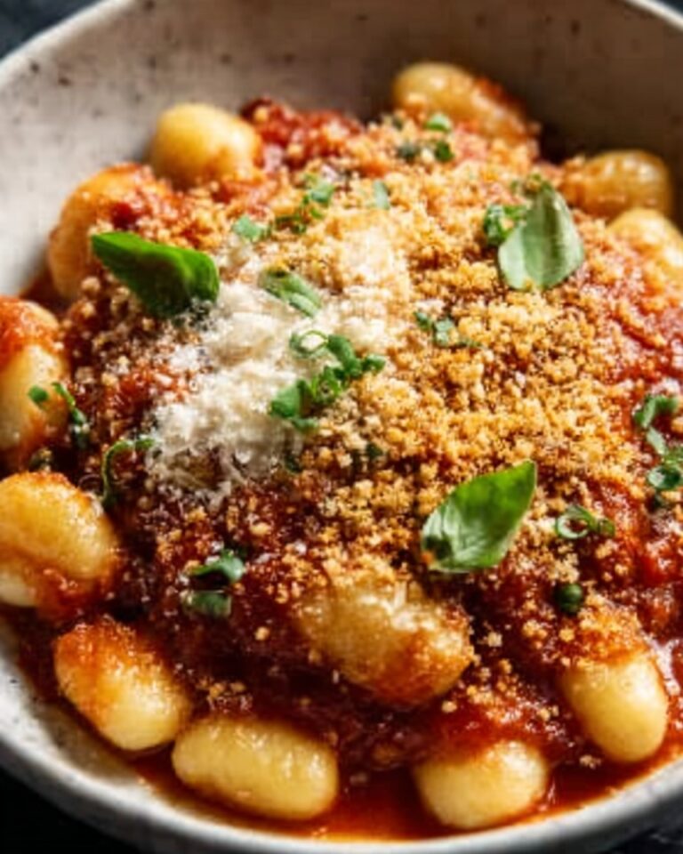 Millionaire Gnocchi with Red Sauce, Herbed Ricotta, and Golden Crispies Recipe